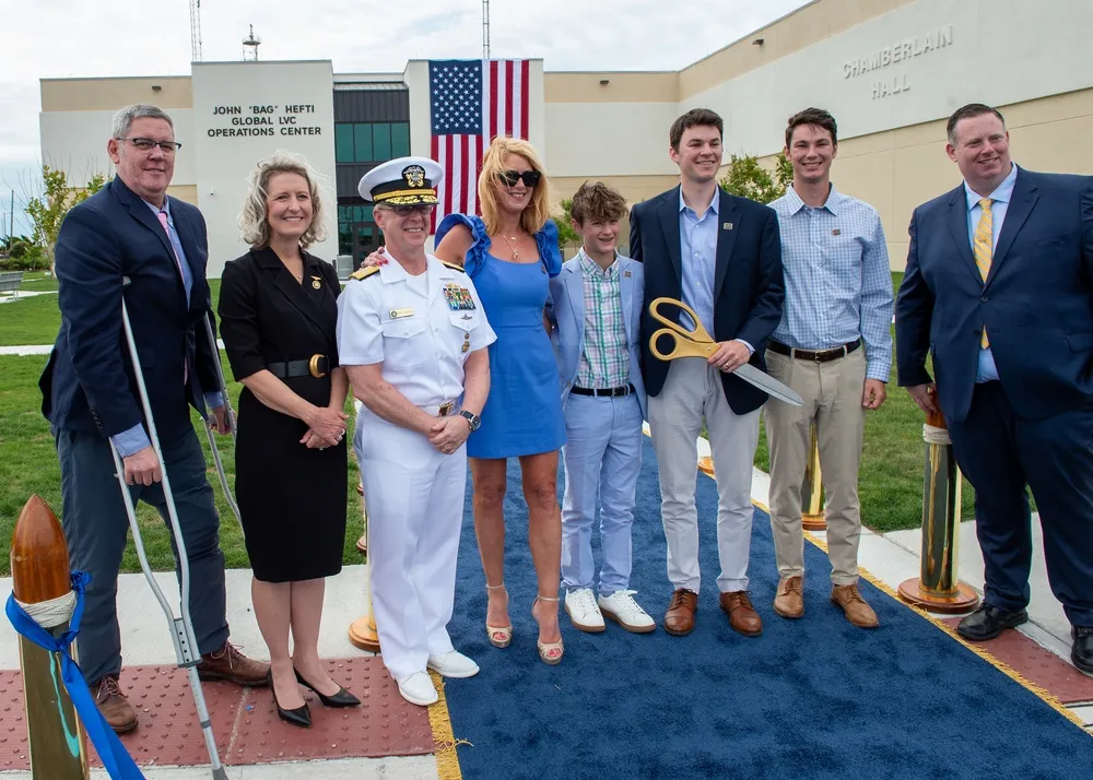 The Hefti family with Admiral Daryl Caudle and Representative Jen Kiggans at the ribbon cutting ceremony