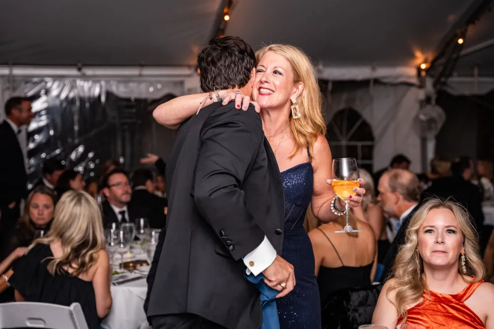 Guests celebrating on the dance floor at a past Bash