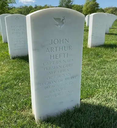 Captain John Arthur Hefti's headstone — CAPT US Navy, Persian Gulf, Legion of Merit — inscribed with the words A Love Without End