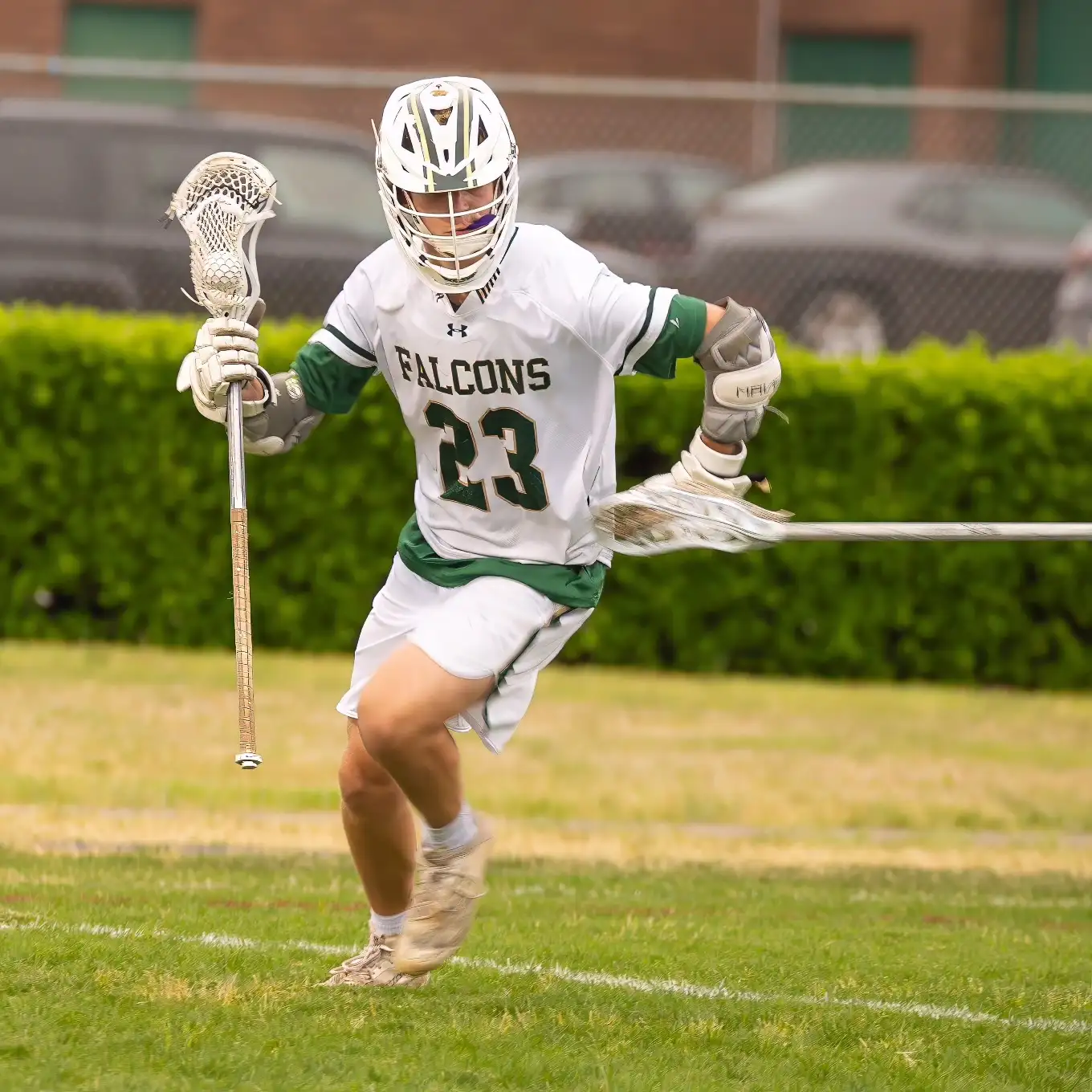 Falcons lacrosse player #23 in action — a Virginia Beach student-athlete supported by Bag's Buddies